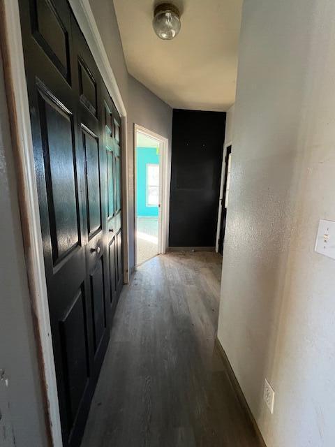 hall featuring dark wood-type flooring