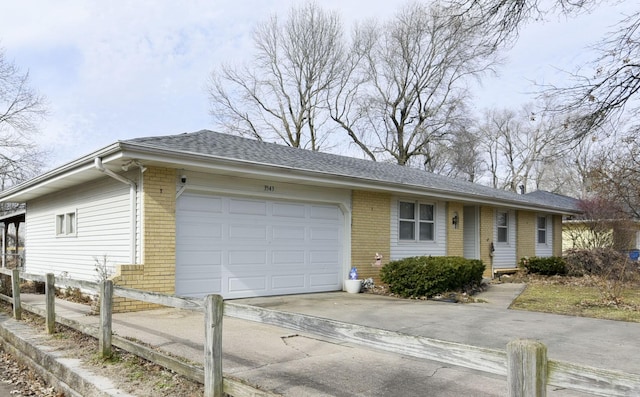 single story home with a garage