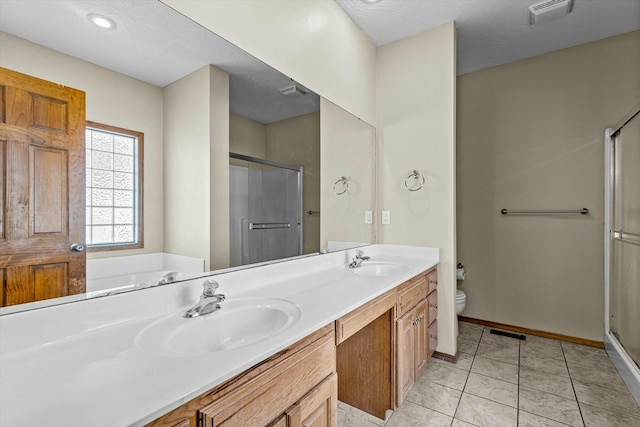 full bathroom with tile patterned floors, vanity, toilet, and separate shower and tub