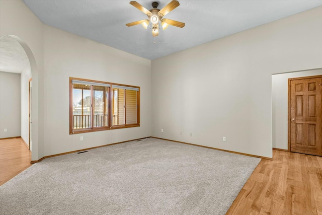 empty room featuring ceiling fan and light wood-type flooring