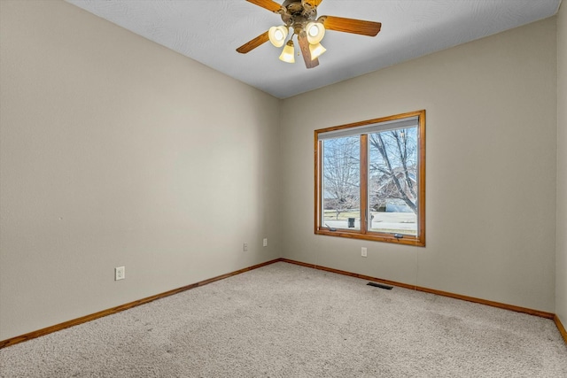 unfurnished room featuring carpet flooring and ceiling fan