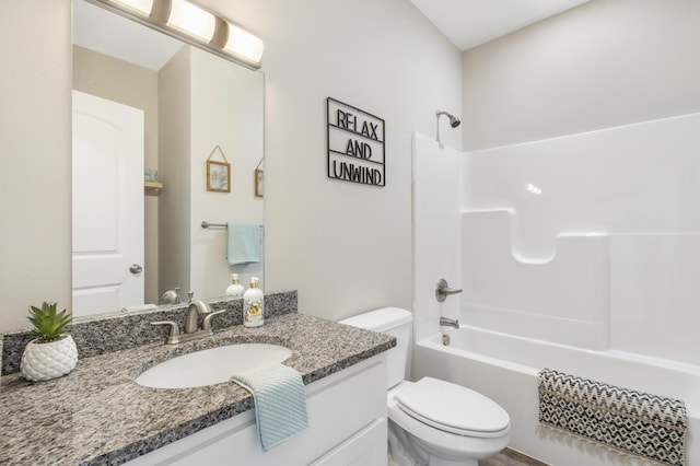 bathroom with toilet, bathtub / shower combination, and vanity