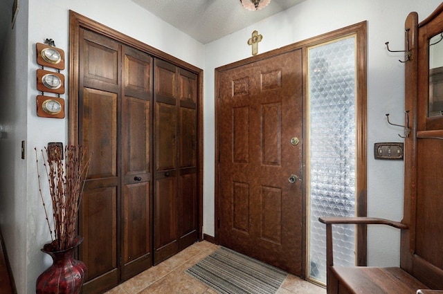 entrance foyer featuring light tile patterned flooring