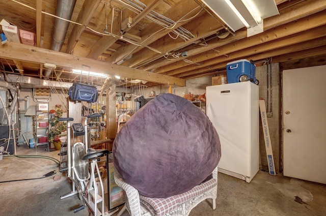 basement featuring white refrigerator