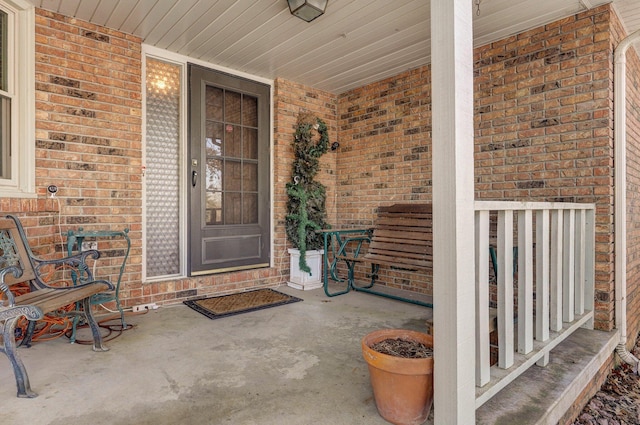 entrance to property featuring covered porch