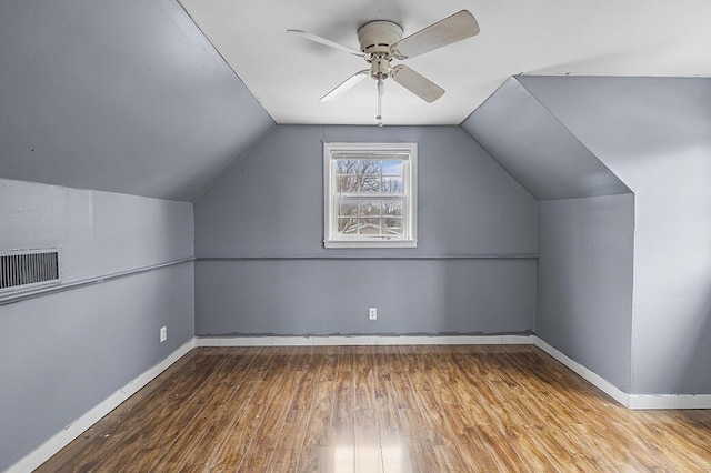 additional living space featuring light hardwood / wood-style flooring, ceiling fan, and vaulted ceiling