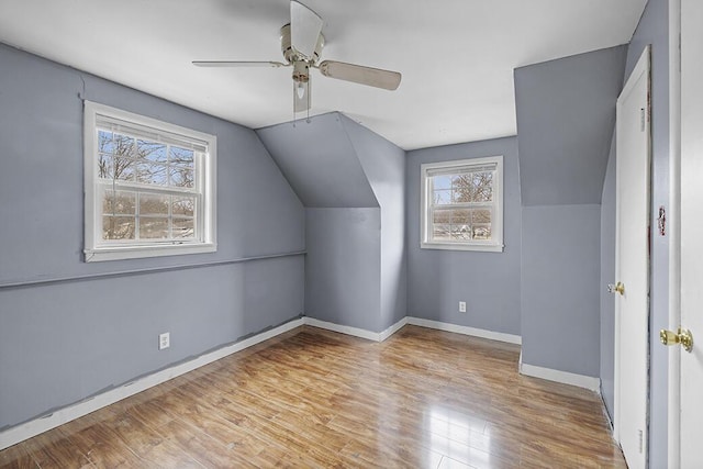 bonus room with ceiling fan, lofted ceiling, and light hardwood / wood-style flooring