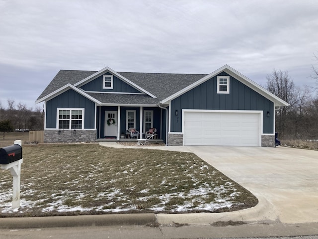 view of front of home featuring a porch and a garage