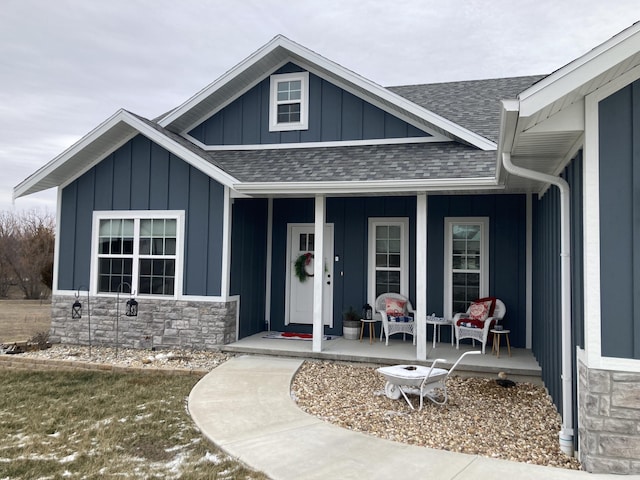 doorway to property featuring covered porch