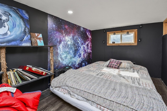 bedroom with dark wood-type flooring