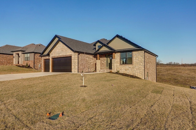 view of front of property featuring an attached garage, stone siding, and a front lawn