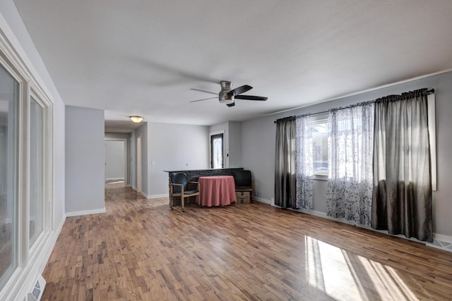 spare room with hardwood / wood-style floors and ceiling fan