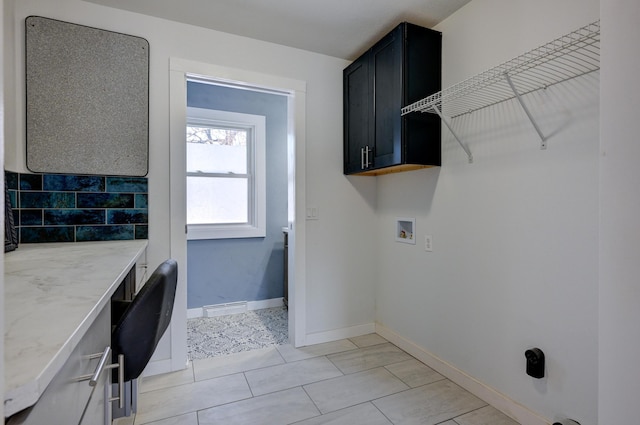 washroom featuring cabinets and hookup for a washing machine