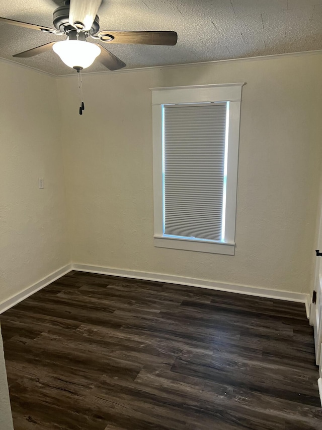 spare room featuring ceiling fan, a textured ceiling, and dark hardwood / wood-style flooring