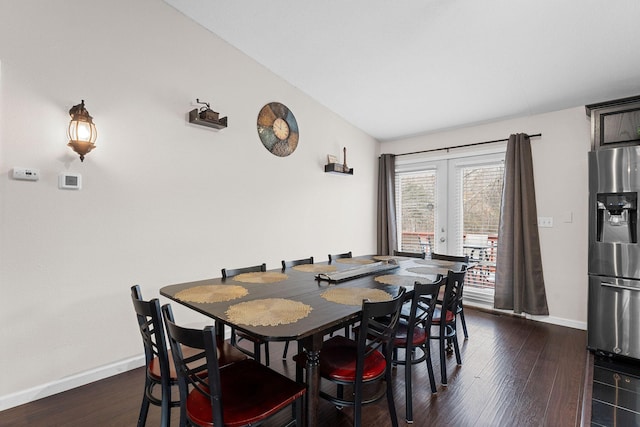 dining space featuring dark wood-type flooring and french doors