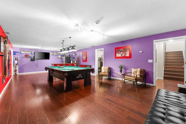 playroom with dark hardwood / wood-style flooring, billiards, and a textured ceiling