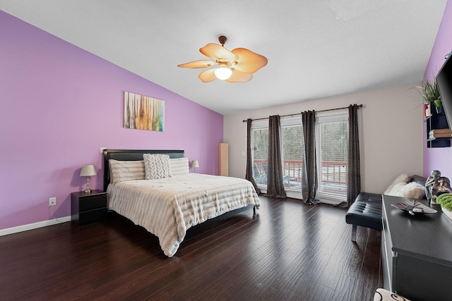 bedroom with vaulted ceiling, dark wood-type flooring, and ceiling fan