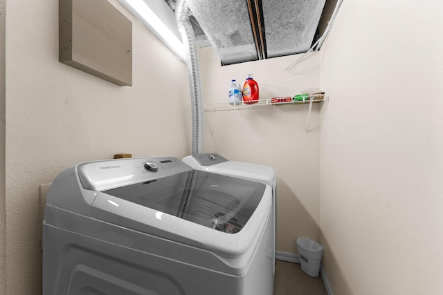laundry room featuring washing machine and dryer