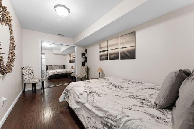 bedroom featuring dark hardwood / wood-style floors