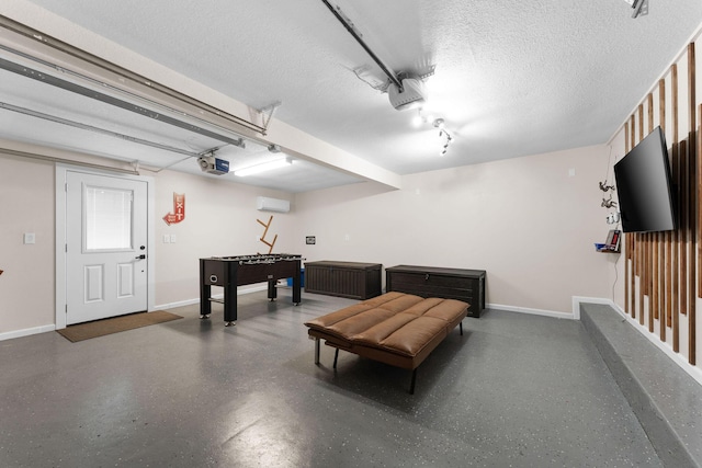 garage featuring a garage door opener and a wall mounted AC