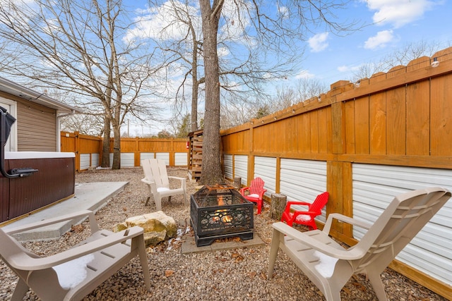 view of yard with a fire pit