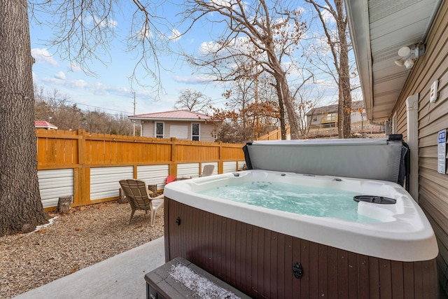 exterior space with a hot tub