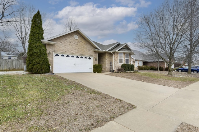 ranch-style house featuring a garage and a front yard