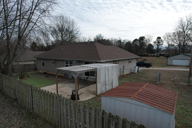 rear view of house with a carport, an outdoor structure, and a garage