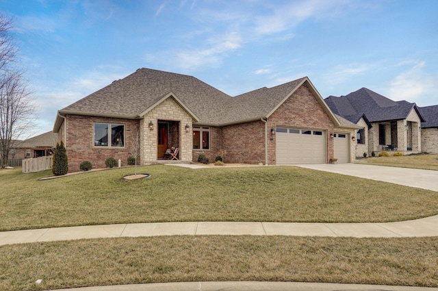 view of front of house with a garage and a front lawn