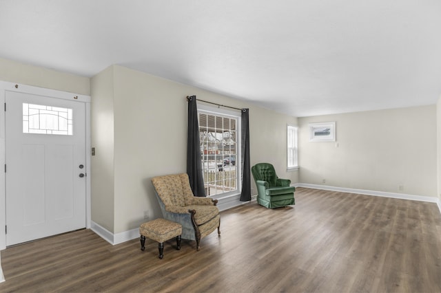 sitting room with wood finished floors and baseboards