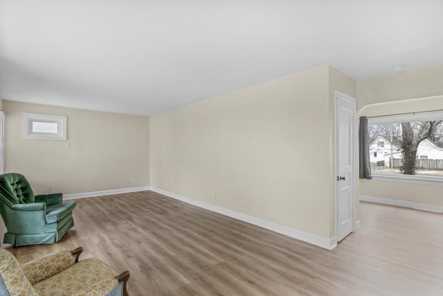 sitting room with light hardwood / wood-style flooring