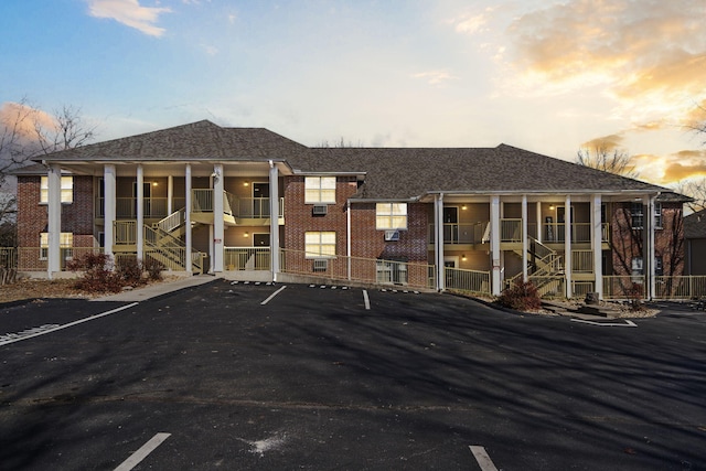 view of outdoor building at dusk