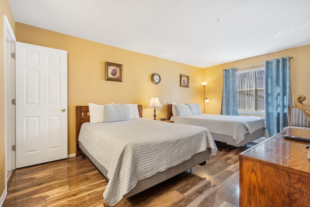 bedroom featuring dark wood-type flooring