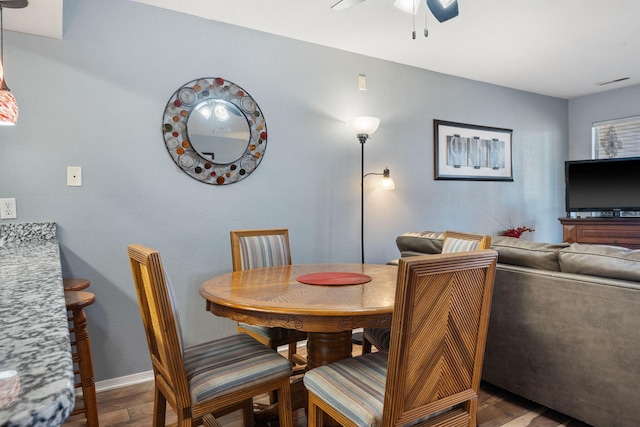 dining room featuring ceiling fan and hardwood / wood-style floors