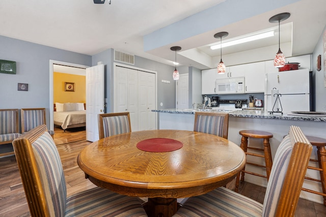 dining room featuring hardwood / wood-style flooring