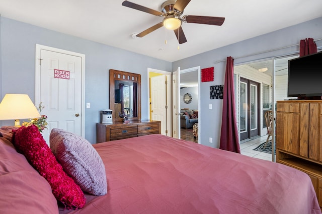 tiled bedroom with ceiling fan