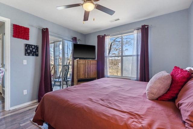 bedroom featuring wood-type flooring, access to outside, and ceiling fan