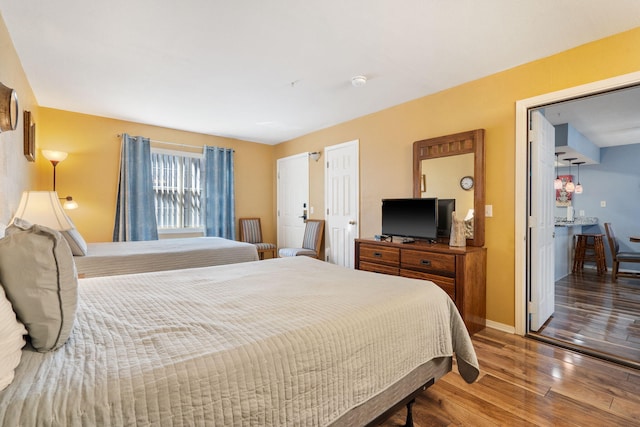 bedroom with hardwood / wood-style floors