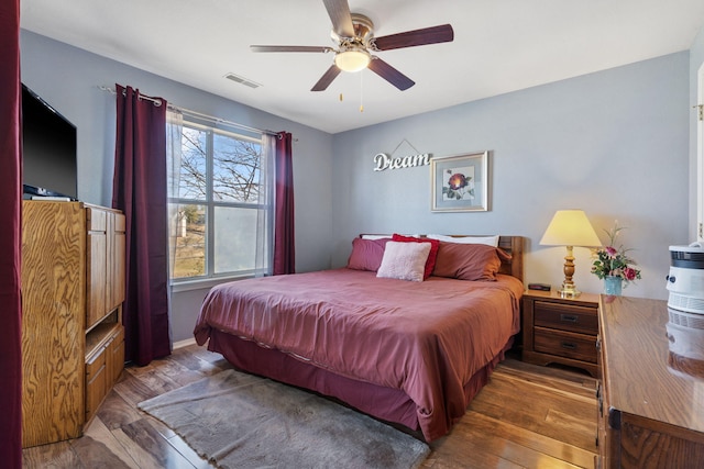 bedroom featuring hardwood / wood-style floors and ceiling fan