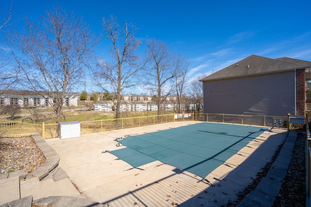 view of swimming pool featuring a patio area