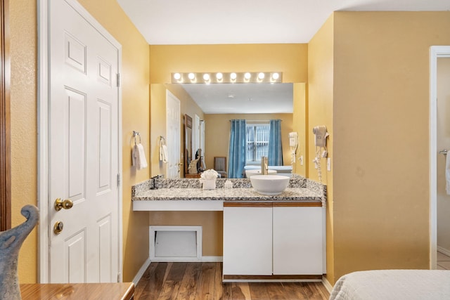 bathroom with vanity and hardwood / wood-style floors