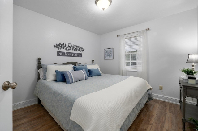 bedroom featuring dark wood-type flooring