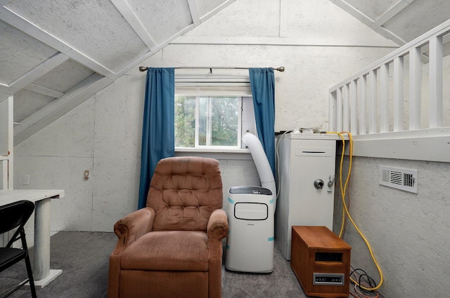 sitting room featuring vaulted ceiling