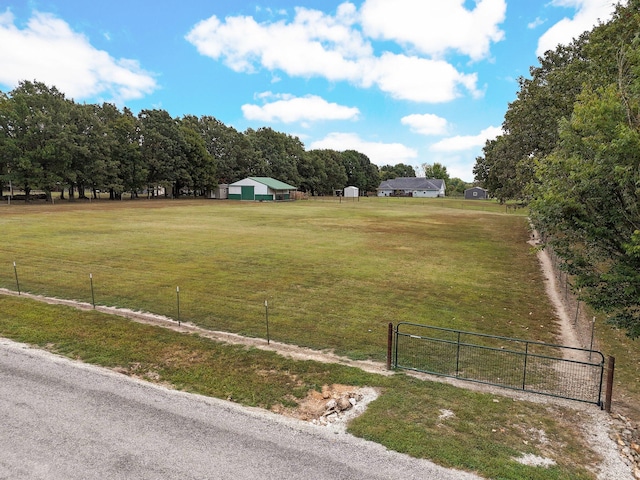 view of yard with a rural view