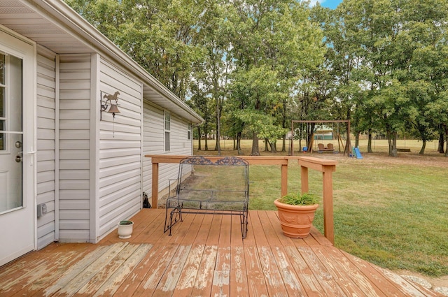 deck featuring a lawn and a playground