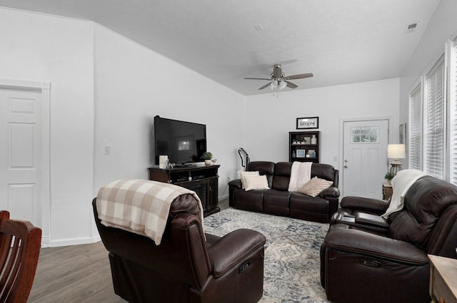 living room featuring hardwood / wood-style flooring and ceiling fan