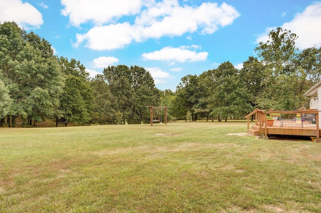 view of yard featuring a wooden deck