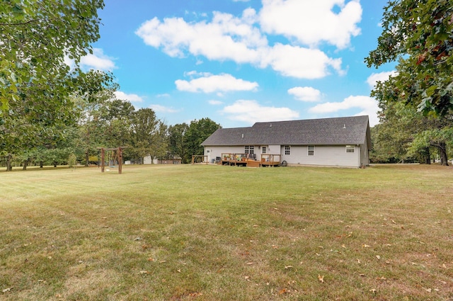 view of yard featuring a wooden deck