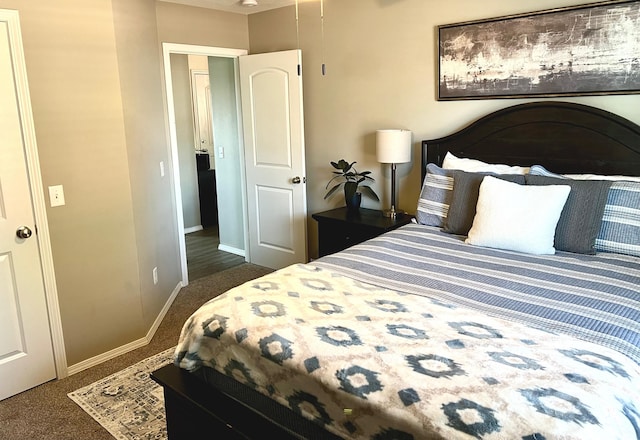 carpeted bedroom with baseboards