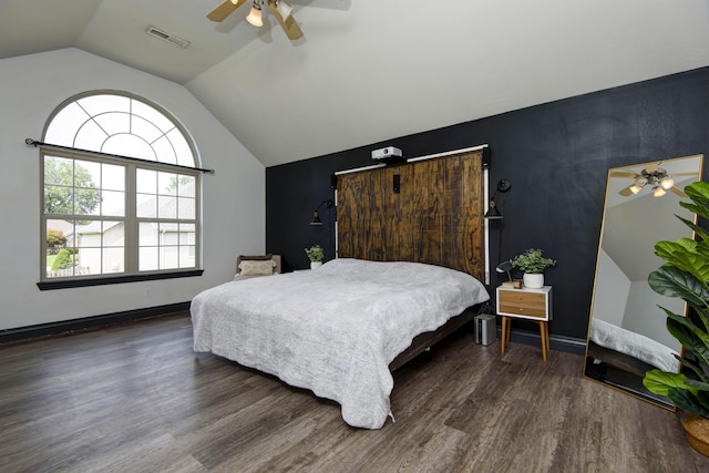 bedroom featuring lofted ceiling, dark hardwood / wood-style floors, and ceiling fan